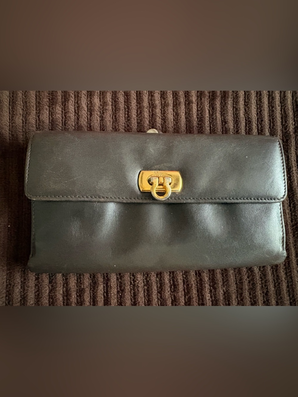 Salvatore Ferragamo Black Leather Clutch with Gold-Tone Signature Lock